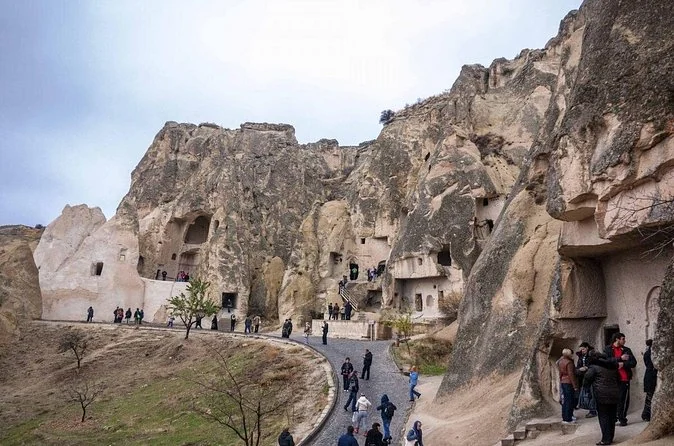A paved path leading between rock formations at Göreme Open Air Museum